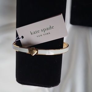 Kate Spade enamel spade bangle in white.
